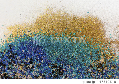 Layered colorful sand pattern. Marble style background. Blue and gold powder texture. Layered colorful sand pattern. Marble style background. Blue and gold powder texture. 47312610