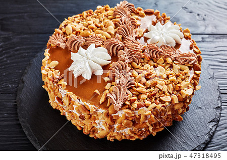 peanut cake topped with cream, close up peanut cake topped with cream, close up 47318495
