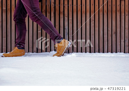 View of shoes or boots footprint in fresh snow. View of shoes or boots footprint in fresh snow. 47319221