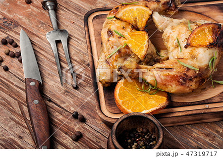 Roast chicken with orange Roast chicken with orange 47319717