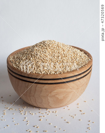 White quinoa in a wooden bowl. Close up. White quinoa in a wooden bowl. Close up. 47320569