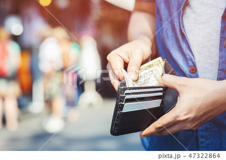 Businessman Person holding an wallet in the hands  47322864