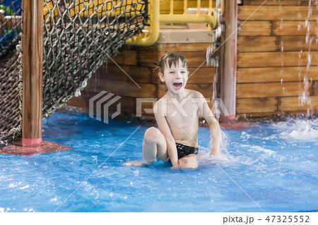 happy child in a small wading pool happy child in a small wading pool 47325552