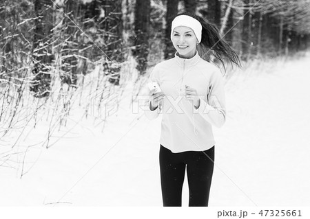 woman listening to music and jogging woman listening to music and jogging 47325661