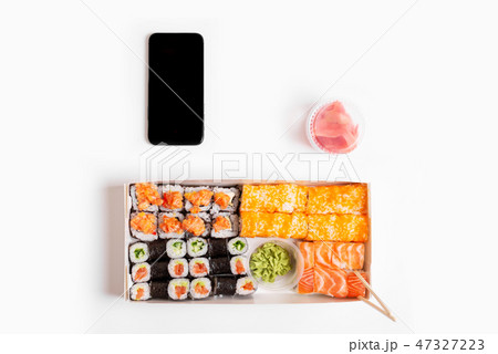 sushi set rolls on white background chopsticks wasabi ginger phone delivery food sushi set rolls on white background chopsticks wasabi ginger phone delivery food 47327223