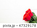 Present gift with red rose flower on wooden table, 14 February o 47329178