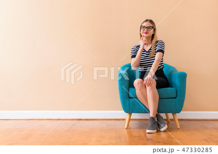 Young woman in a thoughtful pose 47330285