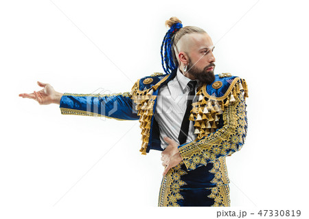 Torero in blue and gold suit or typical spanish bullfighter isolated over white Torero in blue and gold suit or typical spanish bullfighter isolated over white 47330819
