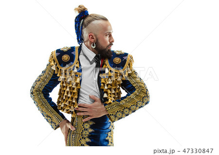 Torero in blue and gold suit or typical spanish bullfighter isolated over white Torero in blue and gold suit or typical spanish bullfighter isolated over white 47330847