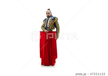 Torero in blue and gold suit or typical spanish bullfighter isolated over white Torero in blue and gold suit or typical spanish bullfighter isolated over white 47331132