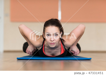 woman yoga, Bhekasana, Frog Pose in gym 47331451