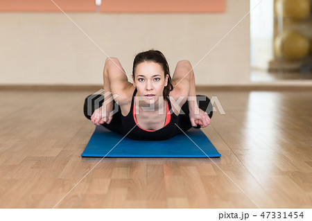 woman yoga, Bhekasana, Frog Pose in gym 47331454