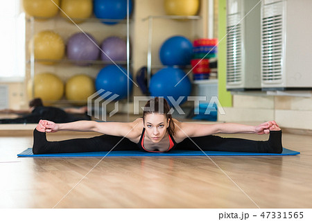 woman practicing yoga Forward Bend Pose woman practicing yoga Forward Bend Pose 47331565