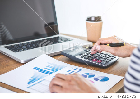 Female accountant calculations, audit and analyzing financial gr Female accountant calculations, audit and analyzing financial gr 47331775