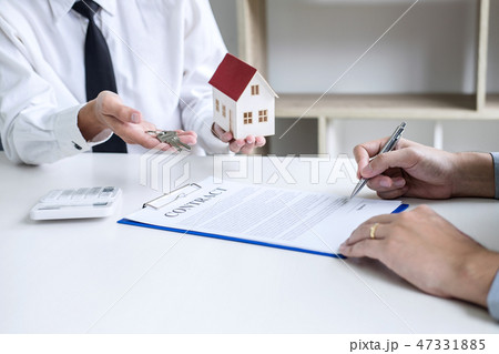 Real estate broker agent presenting and consult to customer to d 47331885