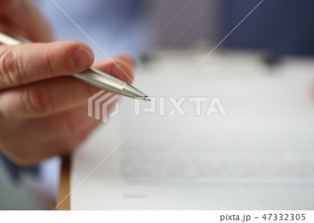 Male arm in suit offer contract form on clipboard Male arm in suit offer contract form on clipboard 47332305