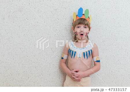 Blond boy playing injun 47333157