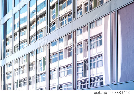 building reflection on glass facade, modern office 47333410