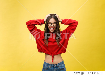Portrait Happy Asian girl is surprised she is excited.Yellow background studio 47334638
