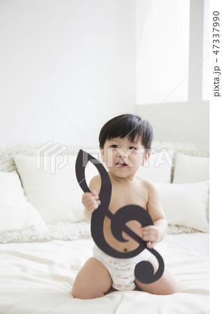 Little two cute babies photo. Baby wearing diaper in white bedroom. 278 47337990