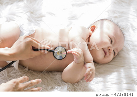 Little two cute babies photo. Baby wearing diaper in white bedroom. 038 47338141