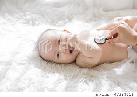 Little two cute babies photo. Baby wearing diaper in white bedroom. 034 47338612