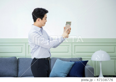 Portrait of a confident businessman' various gestures over gray background 038 Portrait of a confident businessman' various gestures over gray background 038 47338776