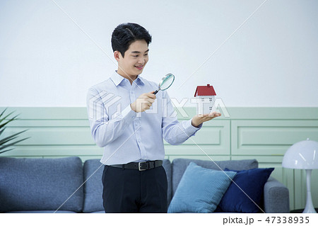 Portrait of a confident businessman' various gestures over gray background 057 47338935