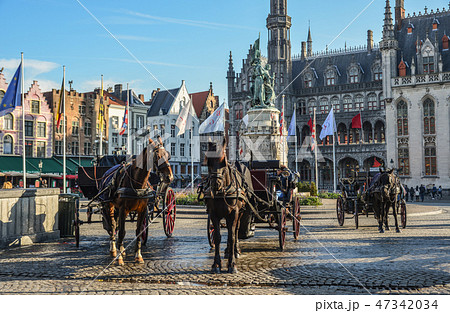 Horse cart in beautiful Bruges town, Belgium 47342034