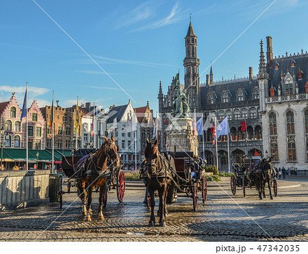 Horse cart in beautiful Bruges town, Belgium 47342035
