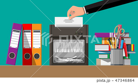 Hand putting document paper in shredder machine. 47346864