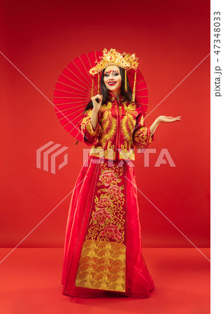 Chinese traditional woman. Beautiful young girl wearing in national costume 47348033