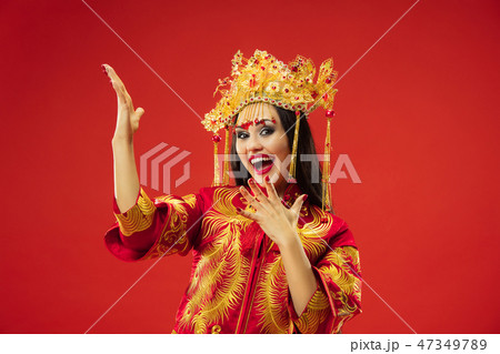Chinese traditional woman. Beautiful young girl wearing in national costume 47349789