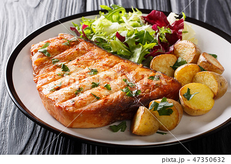 Grilled swordfish steak garnish with fried potato 47350632