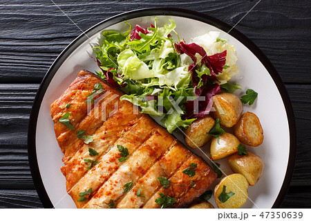 Grilled swordfish fillet with fried potatoes 47350639