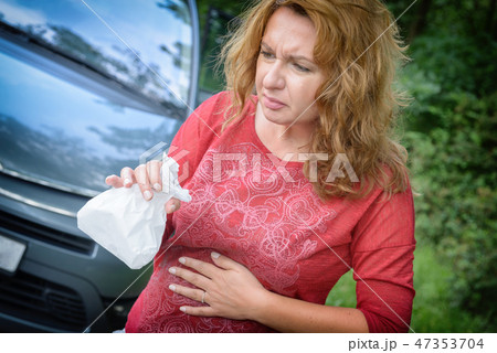 Woman suffering from motion sickness Woman suffering from motion sickness 47353704