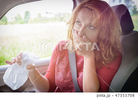 Woman suffering from motion sickness Woman suffering from motion sickness 47353708