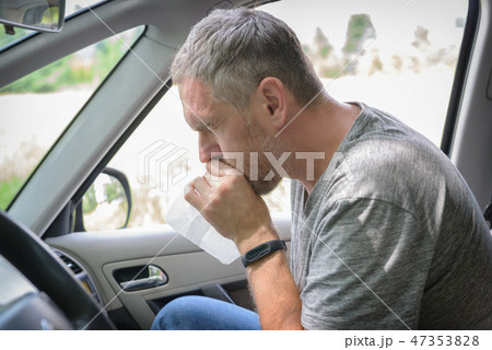 Man suffering from motion sickness Man suffering from motion sickness 47353828