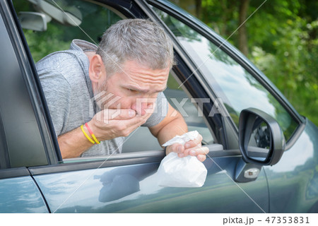 Man suffering from motion sickness 47353831