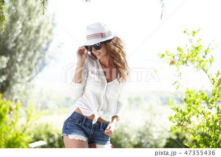 Pretty spring woman in the garden 47355436