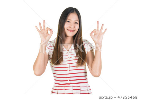 Happy smiling young woman  making ok gesture. 47355468