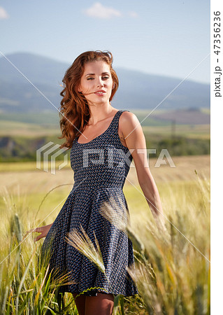 young beautiful woman in the Toscana field young beautiful woman in the Toscana field 47356236