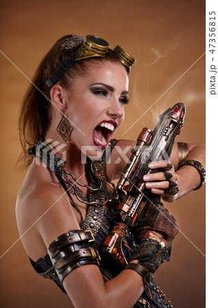 Portrait of a beautiful steampunk woman over smoke background. Portrait of a beautiful steampunk woman over smoke background. 47356815