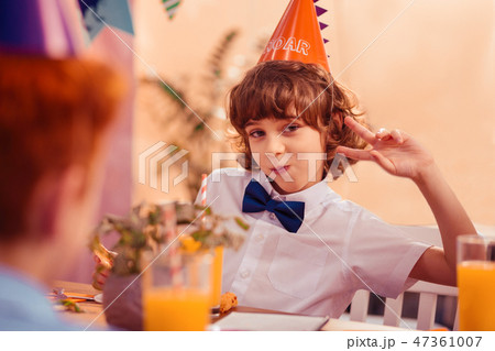 Positive delighted brunette teenager posing on camera 47361007