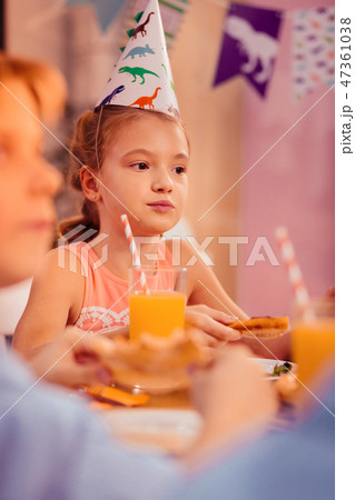 Dreamy birthday girl being deep in thoughts Dreamy birthday girl being deep in thoughts 47361038