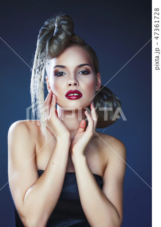 young elegant woman with creative hair style leopard print close up on dark blue background, fashion young elegant woman with creative hair style leopard print close up on dark blue background, fashion 47361728