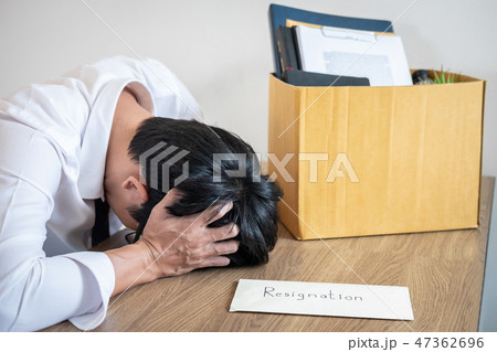 Stressed businessman will being resignation and packing belongin Stressed businessman will being resignation and packing belongin 47362696