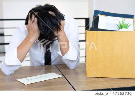 Stressed businessman will being resignation and packing belongin Stressed businessman will being resignation and packing belongin 47362730