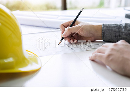 Construction engineering or architect hands working on blueprint 47362736