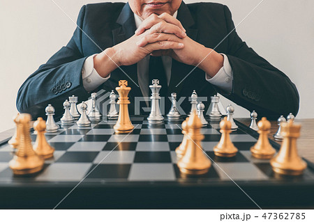 Businessman leadership playing chess and thinking strategy plan Businessman leadership playing chess and thinking strategy plan 47362785